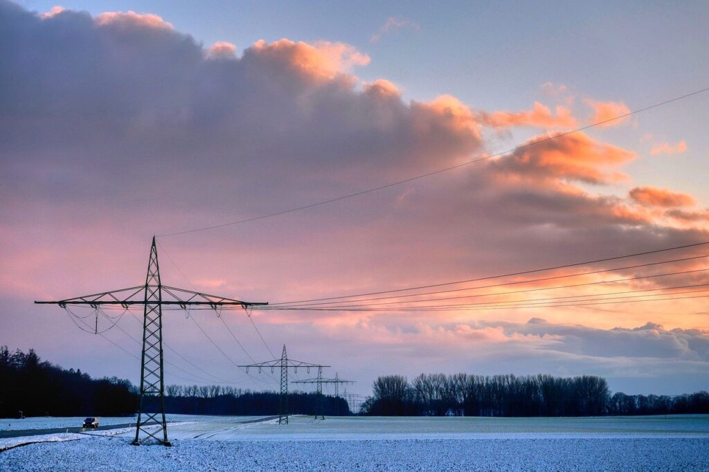 field, high voltage pylons, overhead lines